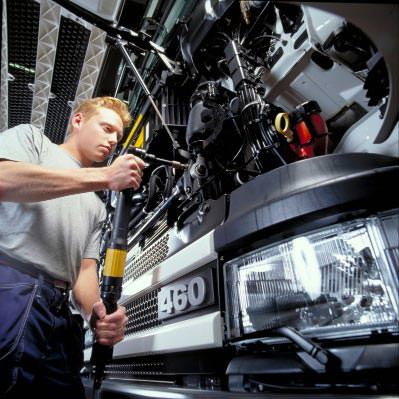 Engineer working on a large commercial vehicle
