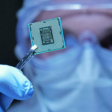 Engineer holding a microchip